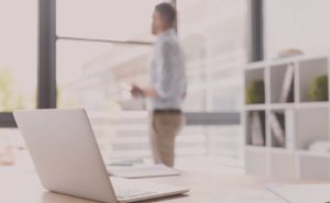 man blurred in an office